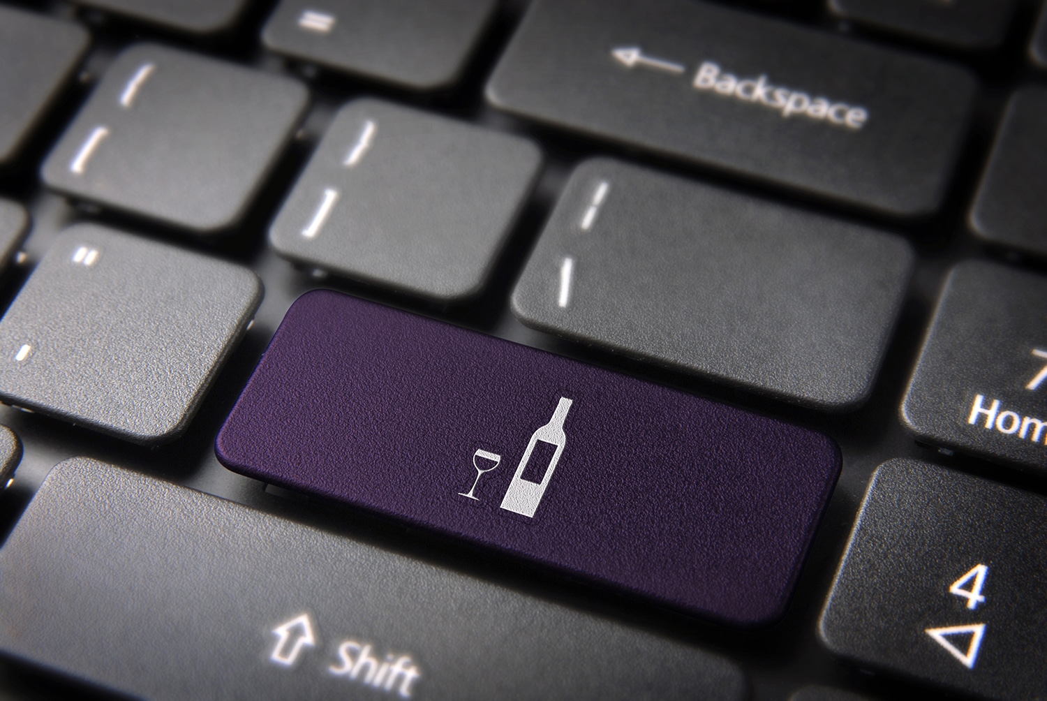 computer keyboard with wine bottle icon