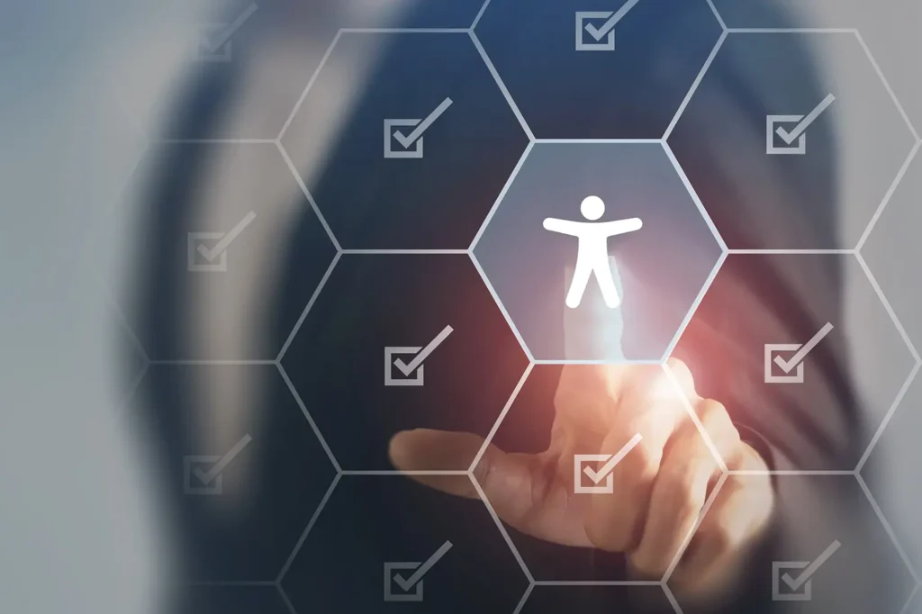 man pointing at accessibility icon surrounded by check marks