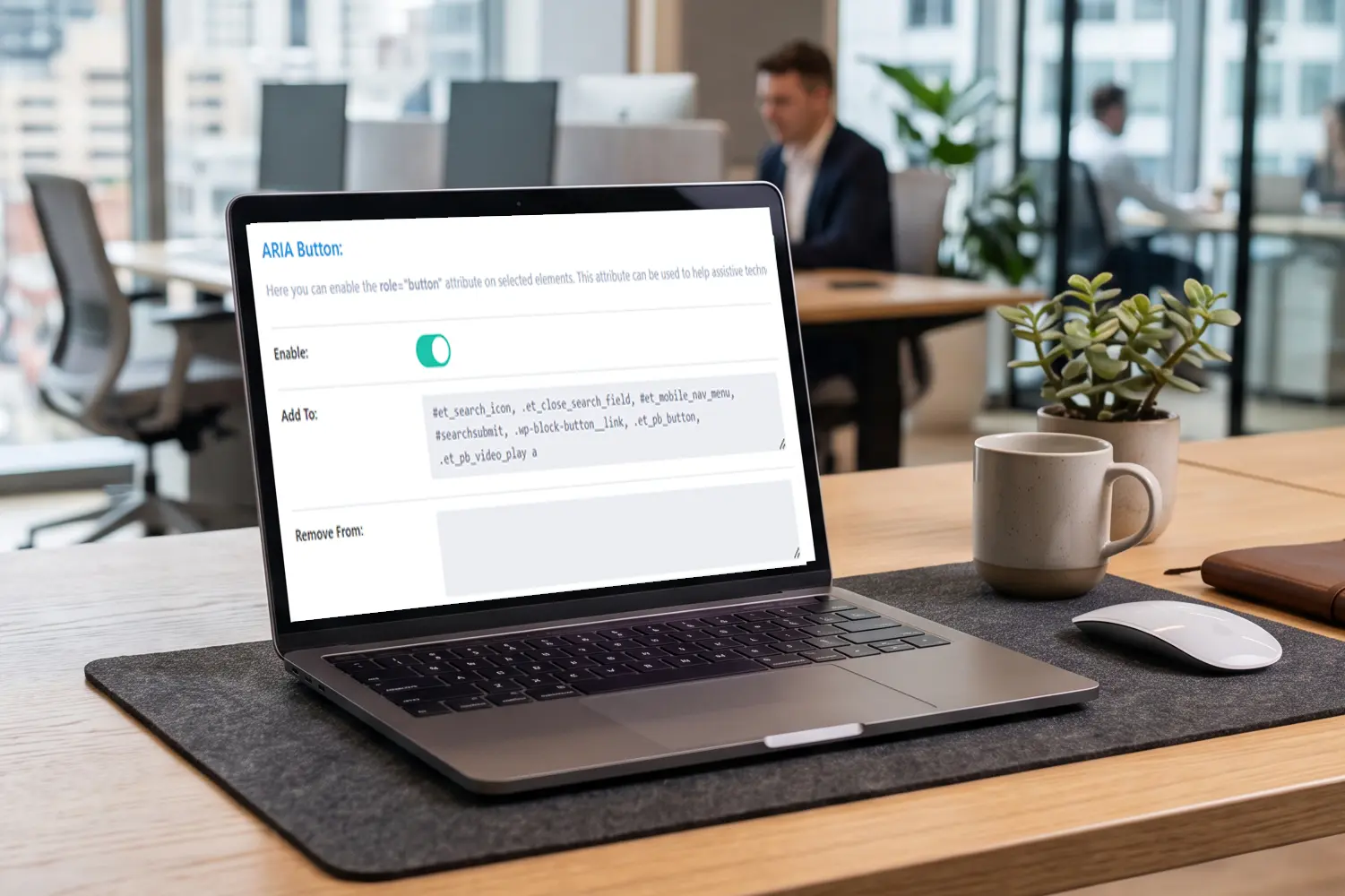 a laptop on a desk with the Divi Attributes UI on the screen